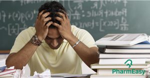 Stressed guy holding his head - How to beat exam stress