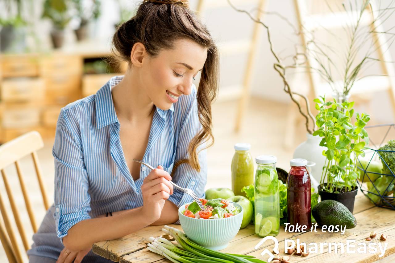 Woman doing yoga exercises. Icons of healthy food, vegetables and