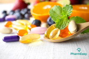 Multivitamin capsules along with foods that are rich source of multivitamins